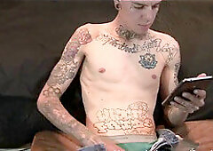 Pierced and tattooed gay stud jerks off in solo alternative session