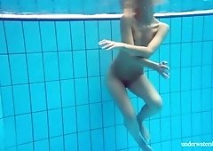 Sweet swimming girl has nothing against flashing her natural titties