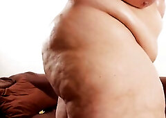 big beautiful woman with biggest boobs, hairless fat snatch and large obese hips showing off and rubs lotion on her body