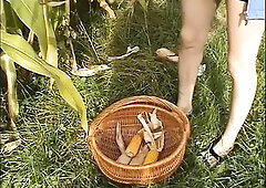 Wicked brunette hair loves masturbating outdoors and filling her one as well as the other holes with a large corn.