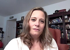 A woman of mature years, with a playful and alluring demeanor, is thoroughly enjoying her time, both in her own company
