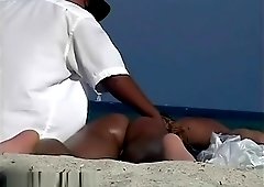 Two extraordinary brunettes have their pussies out in the sun