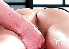 Sensitive brunette is lying on the massage table, while a horny masseur is gently touching her body