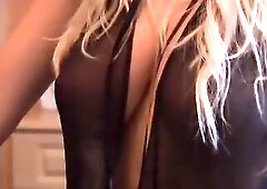 Breasty blond model Michelle Marsh gets topless for a photoshoot
