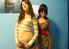 Stunning young brunettes dancing to music and stripping