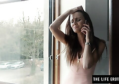 Slim brunette Kira Zen strips nude and rubs her pussy