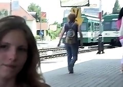 Half-naked teeny squats down to piss at a train station