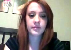 A gorgeous redhead teases and tantalizes in this video, offering a glimpse of her ample assets with a playful boob flash. Her vibrant hair and sultry 