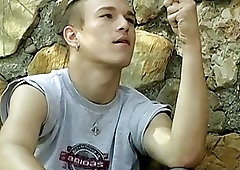 Skinny gay dude smoking outdoors before stripping and jerking off