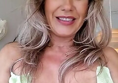 Busty Blonde Tease in Green Dress