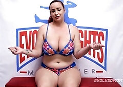 Busty Bella Rossi and Sophia Grace engage in a steamy girl-on-girl wrestling match