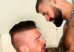 Tattooed hunk penetrates young cocksucker in shower