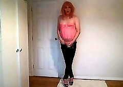 Strawberry blonde in pink basque and leather trousers