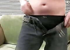 Mature guy jerking off on the green bed