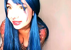 Blue-haired woman fisting her ass with a cucumber and drinking her own urine