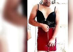 Wearing a vinyl mini red petticoat that squeaks like a siren underneath traffic lights, ebony lace barely caging the chest, laddered fishnets flashing