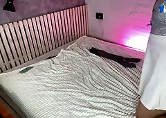 Blonde in lace stockings spreads wide for passionate cunnilingus in pink-lit bedroom