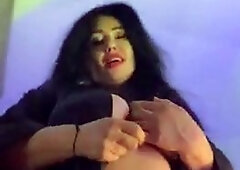 Busty curly brunette with big boobs fucks on couch