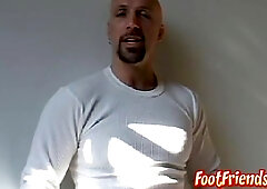 Muscled shaved man Anthony taunting and frolicking with his soles