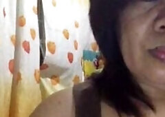 This steamy video features a mature Filipina lady, a granny with a big clit, who teases and pleasures herself on webcam, offering a unique and excitin