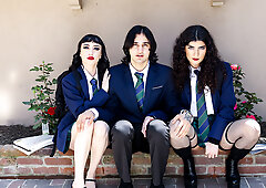 Two goth chicks share a friend's cock on the Halloween