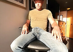 Soaking denim in front of a motel window