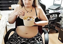 Curvy plump beauty Nicole sits at her desk and devours a massive bowl of takeout with chopsticks, her soft chunky abdomen spilling out as that babe ea