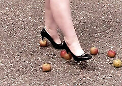 Crush fetish outdoors Corpulent legs in high heel shoes crush apples