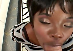 Short-haired ebony babe with big natural boobs gets banged