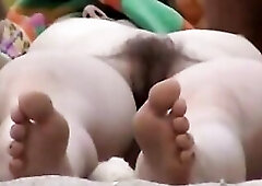 Great looking cuties are enjoying on a nudist beach whilst somebody is secretly recording 'em