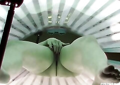 Wicked blond is masturbating in a public solarium, during the time that in front of the hidden camera