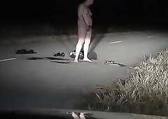 Exhibitionist in the road ripping off clothes and pissing