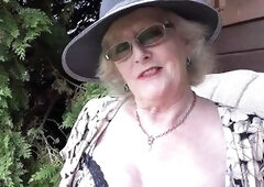 curvy nymphomaniac gilf piddles a giant fountain in the garden and bangs her unshaved vagina with a ebony sex-toy