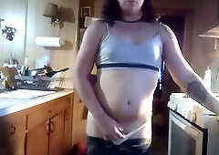 Sexy transwoman strips down in her yellow g-string while doing the dishes and smoking