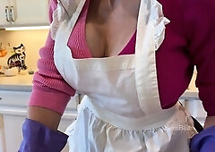 Naughty MILF maid flashing her tits and ass in the kitchen