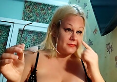 Curvy blonde in fishnets teases with an anal plug and big dildo