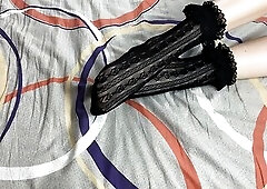 Caressing lengthy legs of angel in ebony lace socks