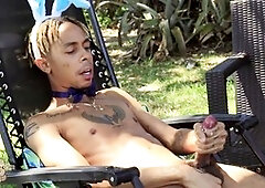 Light-haired bae having fun outdoors with big gay daddy