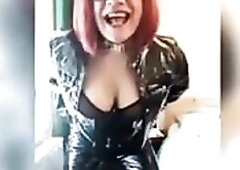 sissy in ebony outfit shows off her large titties and schlong on building stairs