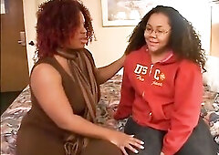 Black big beautiful woman wearing glasses eats and dildoing pussy in couch with her ebony big beautiful woman partner.