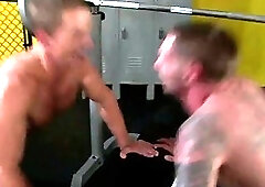 Gay jocks fills his mouth with cock during their workout