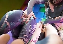 Tattooed girl and alternative girl take on two cocks