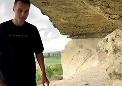 Brown-haired woman with big ass gets deep throat in rocky cave during hike