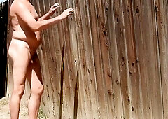 A dad parading around bare in his backyard