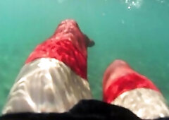 red stocking in the sea at the public beach