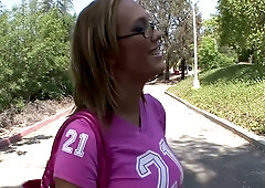 Blonde MILF with glasses gives deep blowjob on pink sheets