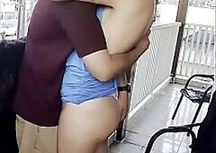 Real pair grinding and getting nasty on the balcony.