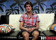 Handsome gay guy strips at an interview and masturbates solo