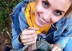 Blonde in denim gets on her knees for a big cock in the forest