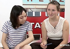 Yuli and Mira explore each other with fingers and toys